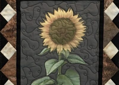 Sunflowers printed on fabric quilt
